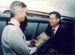 President Fujimoiri receiving a copy of Nido de Viboras, while flying to a meeting in London during the Peruvian hostage crisis.